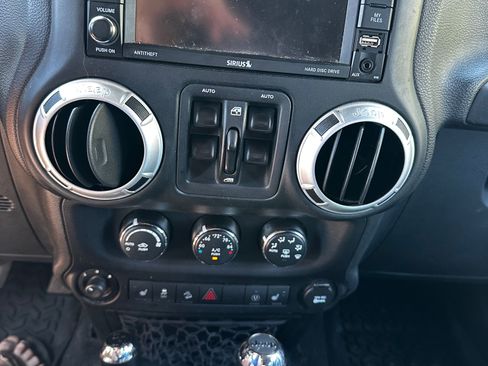Used 2015 Jeep Wrangler Unlimited Sahara w/ Dual Top Group AWD/4WD image 11