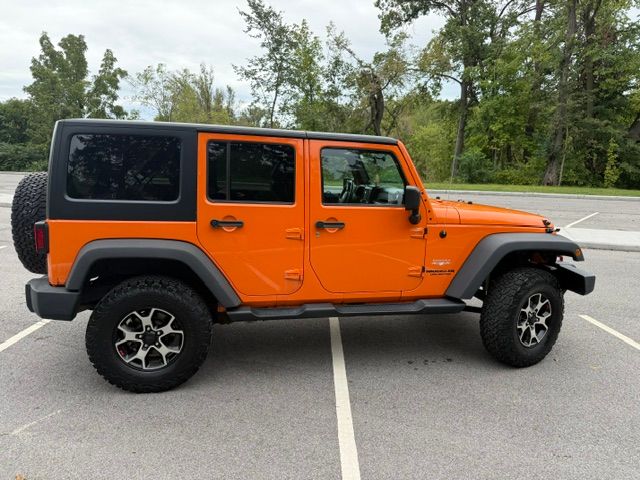 Used 2012 Jeep Wrangler Unlimited Sahara w/ Dual Top Group AWD/4WD image 1
