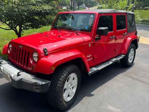 Used 2012 Jeep Wrangler Unlimited Sahara AWD/4WD image 1