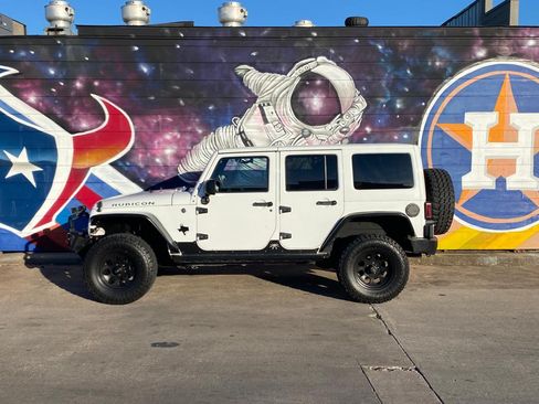 Used 2013 Jeep Wrangler Unlimited Rubicon w/ Dual Top Group image 1