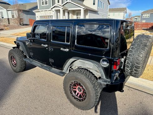 Used 2013 Jeep Wrangler Unlimited Sahara w/ Dual Top Group image 1