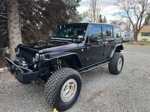 Used 2010 Jeep Wrangler Unlimited Rubicon w/ Dual Top Group AWD/4WD image 1