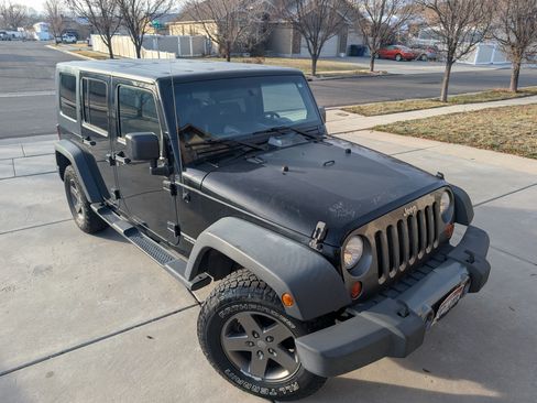 Used 2010 Jeep Wrangler Unlimited Sport image 1