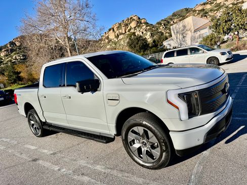 Used 2023 Ford F150 Lightning XLT w/ Equipment Group 312A High image 1