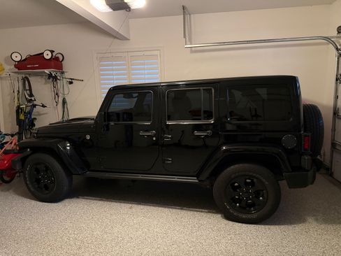 Used 2015 Jeep Wrangler Unlimited Sahara AWD/4WD image 1