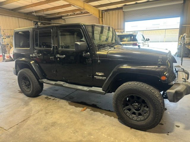 Used 2013 Jeep Wrangler Unlimited Sahara AWD/4WD image 1