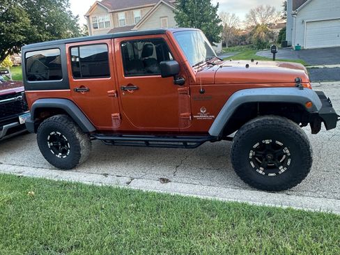 Used 2011 Jeep Wrangler Unlimited Sport AWD/4WD image 1