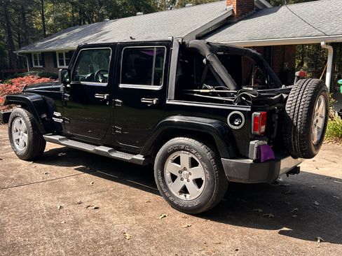 Used 2010 Jeep Wrangler Unlimited Sahara w/ Dual Top Group image 1