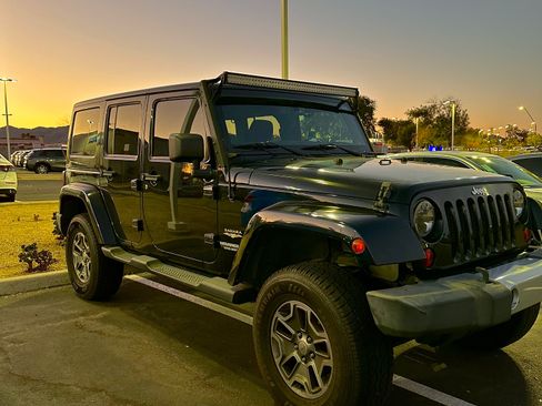 Used 2013 Jeep Wrangler Unlimited Sahara w/ Dual Top Group AWD/4WD image 1