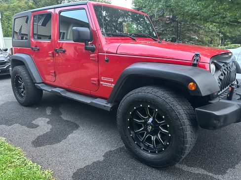 Used 2011 Jeep Wrangler Unlimited Sport AWD/4WD image 1