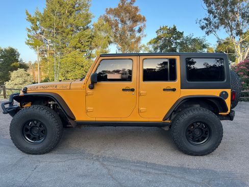 Used 2012 Jeep Wrangler Unlimited Sport w/ Black Appearance Group AWD/4WD image 12