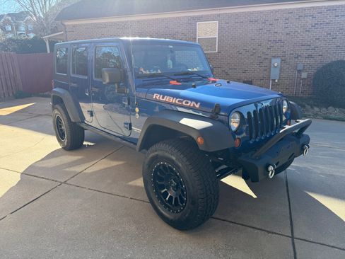 Used 2009 Jeep Wrangler Unlimited Rubicon w/ Dual Top Group image 1