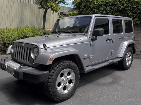 Used 2014 Jeep Wrangler Unlimited Sahara w/ Max Tow Package image 1