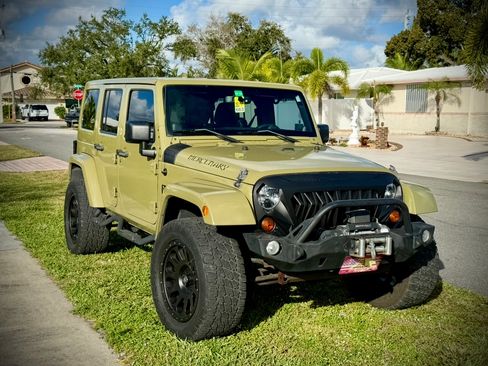 Used 2013 Jeep Wrangler Unlimited Sahara w/ Mopar Chrome Edition Group AWD/4WD image 1